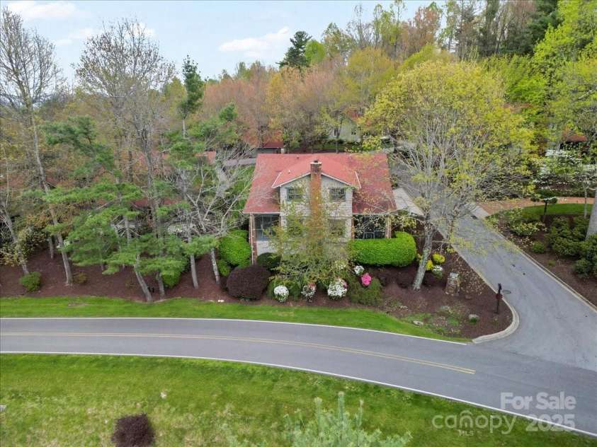 28 Lacoste Drive, Hendersonville, NC 28739.  MLS# CAR4246856, YatesRealty ID 15335. Lacoste aerial corner lot and dual screen porches