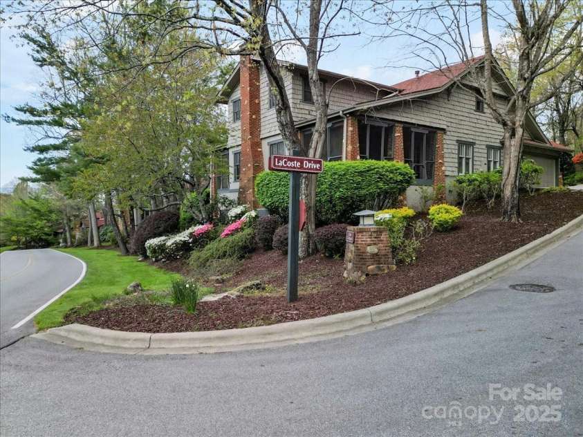 28 Lacoste Drive, Hendersonville, NC 28739.  MLS# CAR4246856, YatesRealty ID 15335. Lacoste Corner View
