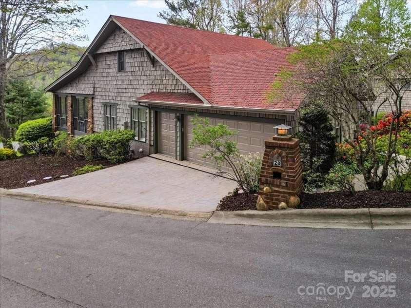 28 Lacoste Drive, Hendersonville, NC 28739.  MLS# CAR4246856, YatesRealty ID 15335. Lacoste Driveway and Garage View