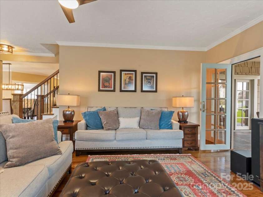 28 Lacoste Drive, Hendersonville, NC 28739.  MLS# CAR4246856, YatesRealty ID 15335. Living room into porch