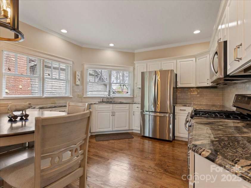 28 Lacoste Drive, Hendersonville, NC 28739.  MLS# CAR4246856, YatesRealty ID 15335. Lovely custom kitchen with granite and lots of light and new stainless appliances