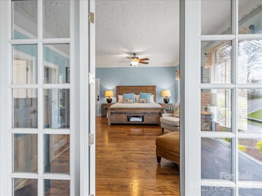 28 Lacoste Drive, Hendersonville, NC 28739.  MLS# CAR4246856, YatesRealty ID 15335. Porch to owner suite