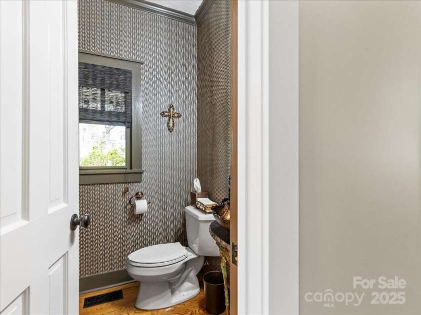 28 Lacoste Drive, Hendersonville, NC 28739.  MLS# CAR4246856, YatesRealty ID 15335. Powder room first floor