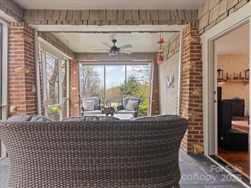 28 Lacoste Drive, Hendersonville, NC 28739.  MLS# CAR4246856, YatesRealty ID 15335. Private Screened porch off Owner Suite