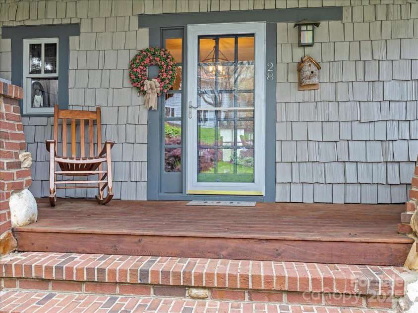 28 Lacoste Drive, Hendersonville, NC 28739.  MLS# CAR4246856, YatesRealty ID 15335. Welcoming large front porch