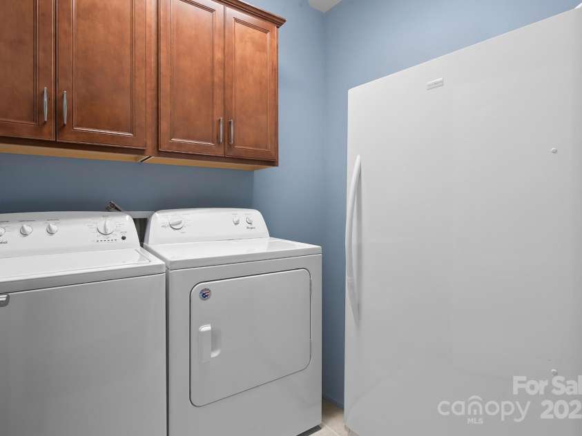 689 Birchway Drive, Fort Mill, SC 29715.  MLS# CAR4291605, YatesRealty ID 15345. Laundry Room w/cabinets - includes washer/dryer
