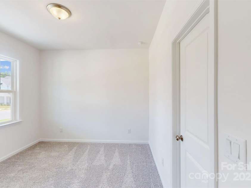11105 Lochmere Road, Charlotte, NC 28278.  MLS# CAR4228899, YatesRealty ID 15346. Main level guest bedroom