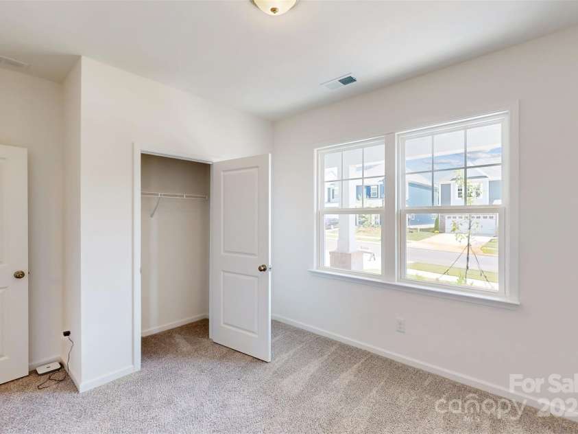 11105 Lochmere Road, Charlotte, NC 28278.  MLS# CAR4228899, YatesRealty ID 15346. Main level guest bedroom