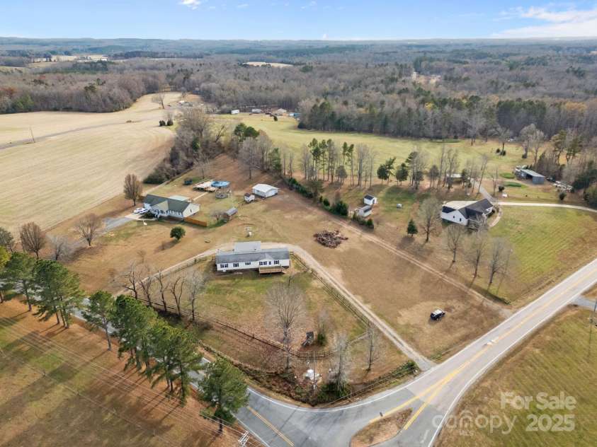 21465 Old Beatty Ford Road, Gold Hill, NC 28071.  MLS# CAR4326908, YatesRealty ID 1535. Over an acre of land on a nice corner lot