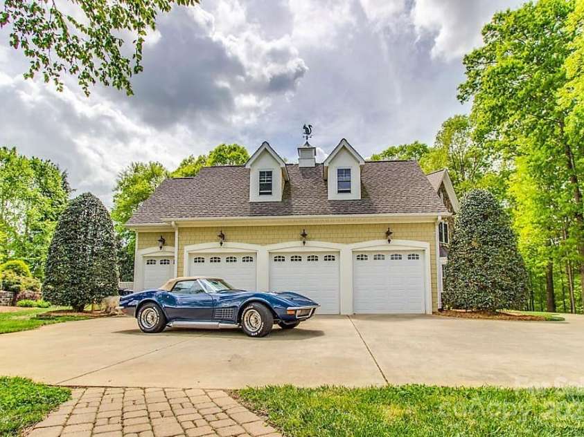 3400 Baucom Manor Road, Monroe, NC 28110.  MLS# CAR4250863, YatesRealty ID 15352. 3-car garage & golf cart side-load garage w/epoxy flooring, built-in sink, work bench & cabinets