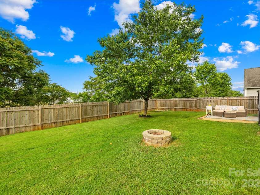 105 Altondale Drive, Statesville, NC 28625.  MLS# CAR4250668, YatesRealty ID 15356. Backyard with firepit