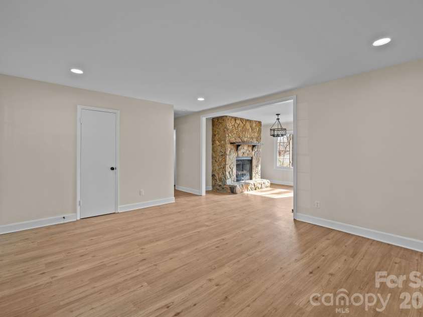 7101 Woodstock Drive, Charlotte, NC 28210.  MLS# CAR4342371, YatesRealty ID 15364. Stone Fireplace Dining Area