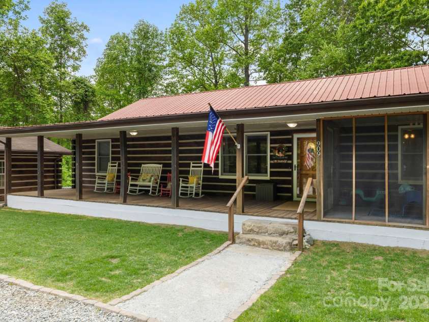 909 Pearson Falls Road, Saluda, NC 28773.  MLS# CAR4256456, YatesRealty ID 15364. 