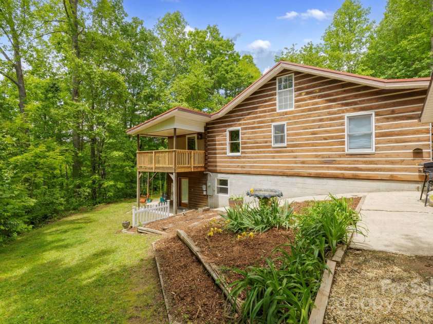 909 Pearson Falls Road, Saluda, NC 28773.  MLS# CAR4256456, YatesRealty ID 15364. 