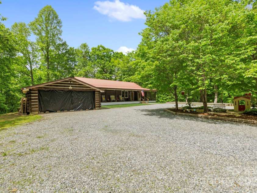 909 Pearson Falls Road, Saluda, NC 28773.  MLS# CAR4256456, YatesRealty ID 15364. 
