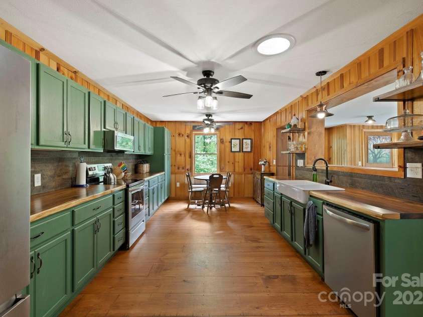 909 Pearson Falls Road, Saluda, NC 28773.  MLS# CAR4256456, YatesRealty ID 15364. 