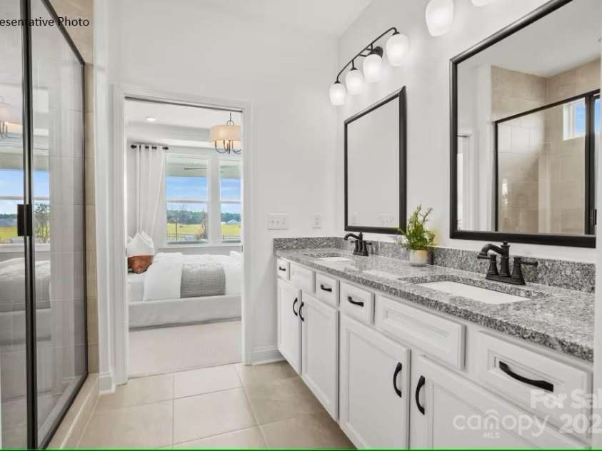 2658 Headwind Court, Belmont, NC 28012.  MLS# CAR4260374, YatesRealty ID 15379. ...With dual vanities, walk-in shower with tiled bench seat, and walk-in closet