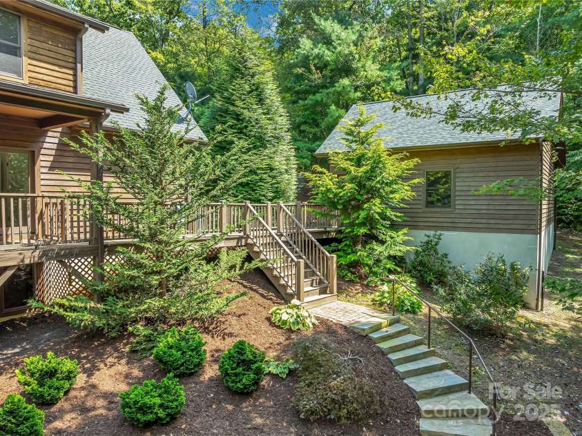 224 Corsica Lane, Saluda, NC 28773.  MLS# CAR4294125, YatesRealty ID 15383. Basement can be accessed via the inside stairs or this lovely path outside