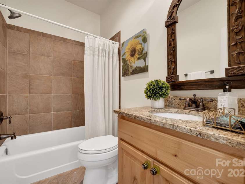 224 Corsica Lane, Saluda, NC 28773.  MLS# CAR4294125, YatesRealty ID 15383. Full hall bath on the first floor