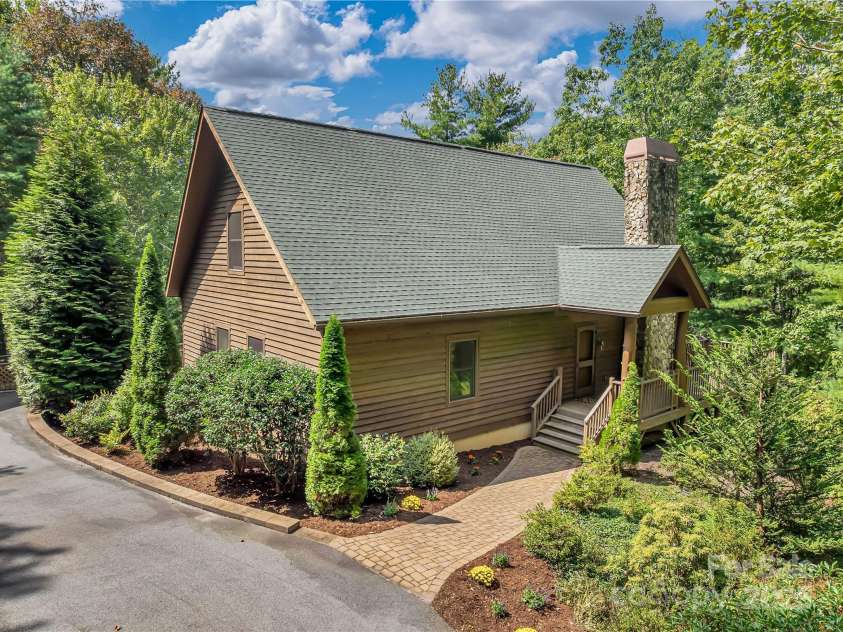 224 Corsica Lane, Saluda, NC 28773.  MLS# CAR4294125, YatesRealty ID 15383. Mature landscaping is low maintenance. No grass to mow.