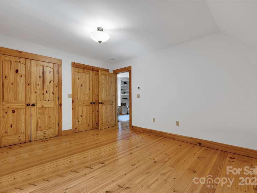 224 Corsica Lane, Saluda, NC 28773.  MLS# CAR4294125, YatesRealty ID 15383. Upstairs bedroom with 2 closets