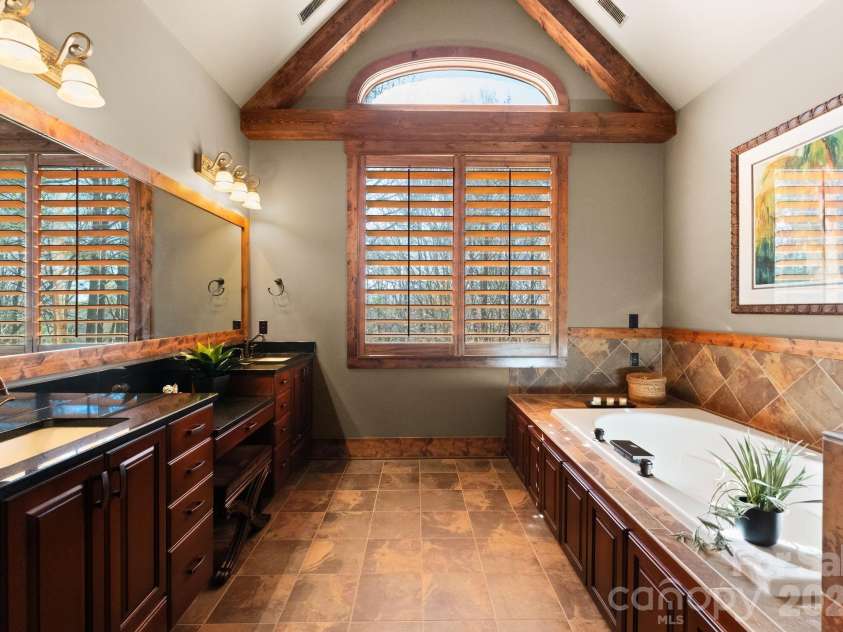 4068 Flagstone Drive, Lancaster, SC 29720.  MLS# CAR4347552, YatesRealty ID 15387. Primary bathroom offers Jacuzzi, double sinks with make up vanity