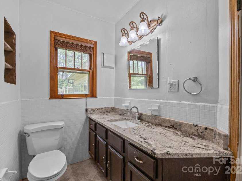 213 Monticello Road, Weaverville, NC 28787.  MLS# CAR4228856, YatesRealty ID 15391. Second bathroom on main level