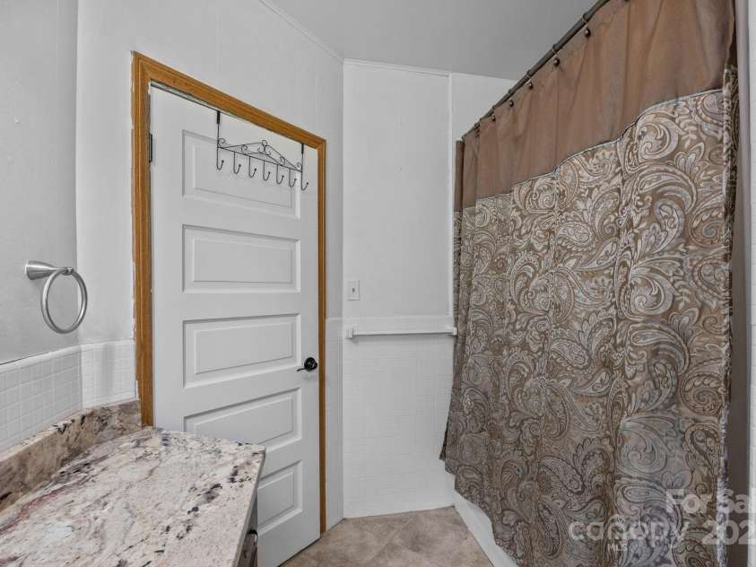 213 Monticello Road, Weaverville, NC 28787.  MLS# CAR4228856, YatesRealty ID 15391. Second bathroom on main level