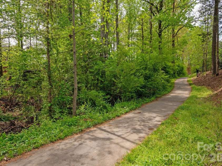 2800 Bevis Lane, Waxhaw, NC 28173.  MLS# CAR4366294, YatesRealty ID 15391. Paved walking trails with a shaded tree canopy