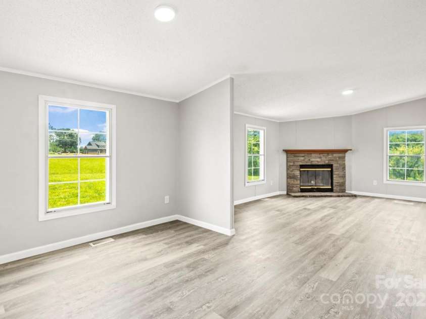 1133 Lynn Lane, Catawba, NC 28609.  MLS# CAR4275480, YatesRealty ID 1540. Family room with stone fireplace