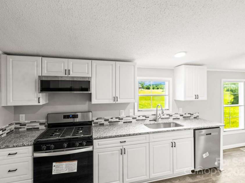 1133 Lynn Lane, Catawba, NC 28609.  MLS# CAR4275480, YatesRealty ID 1540. Gas stove and built in microwave