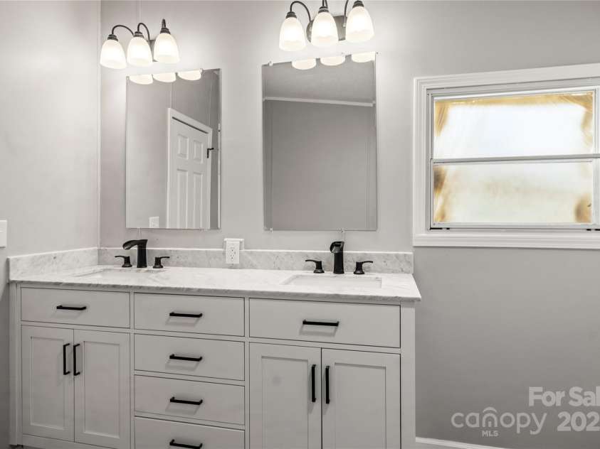 1133 Lynn Lane, Catawba, NC 28609.  MLS# CAR4275480, YatesRealty ID 1540. New Double bowl vanity with granite counter tops, new light fixtures and waterfall sinks