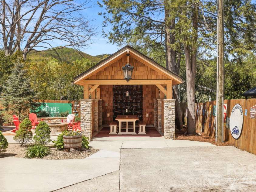 107 5th Street, Black Mountain, NC 28711.  MLS# CAR4371363, YatesRealty ID 15401. Back yard and Carport w/ attached room w/ sauna