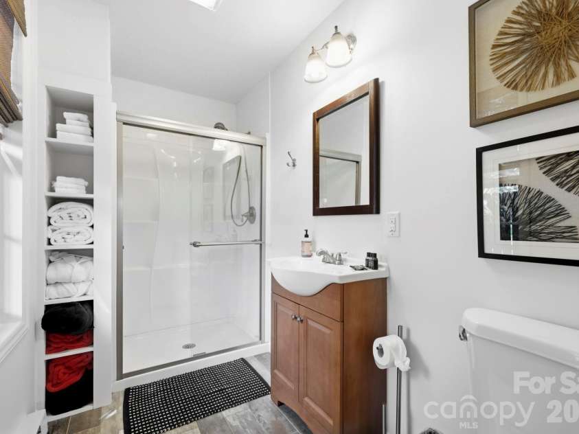 107 5th Street, Black Mountain, NC 28711.  MLS# CAR4371363, YatesRealty ID 15401. Main level back house Bathroom