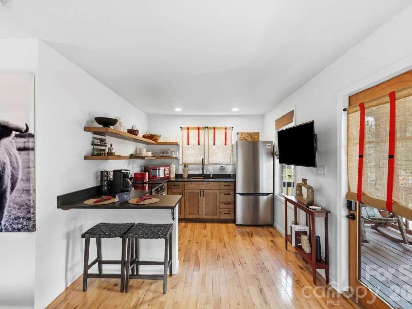 107 5th Street, Black Mountain, NC 28711.  MLS# CAR4371363, YatesRealty ID 15401. Main level back house kitchen