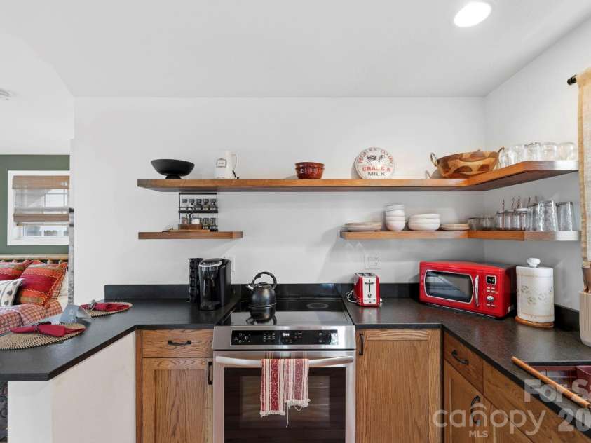 107 5th Street, Black Mountain, NC 28711.  MLS# CAR4371363, YatesRealty ID 15401. Main level back house kitchen