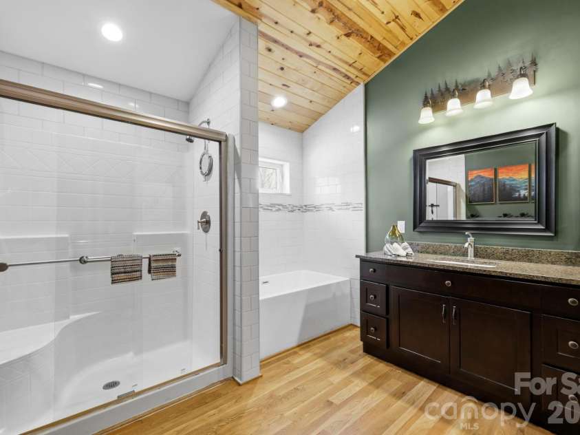 107 5th Street, Black Mountain, NC 28711.  MLS# CAR4371363, YatesRealty ID 15401. Primary Bath w/ shower and soaking tub