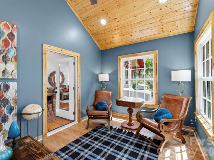 107 5th Street, Black Mountain, NC 28711.  MLS# CAR4371363, YatesRealty ID 15401. Sunroom off living room
