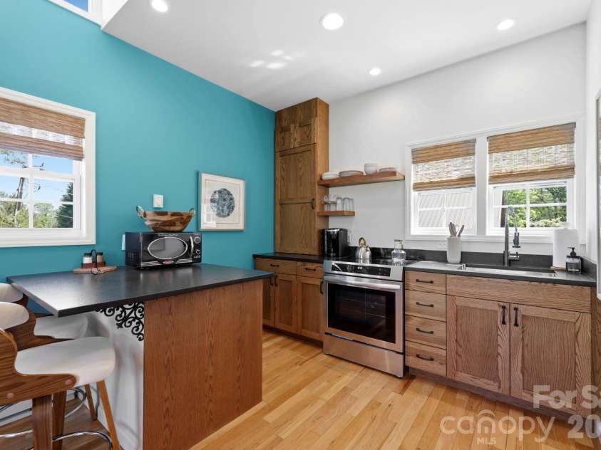 107 5th Street, Black Mountain, NC 28711.  MLS# CAR4371363, YatesRealty ID 15401. Upper level back house kitchen