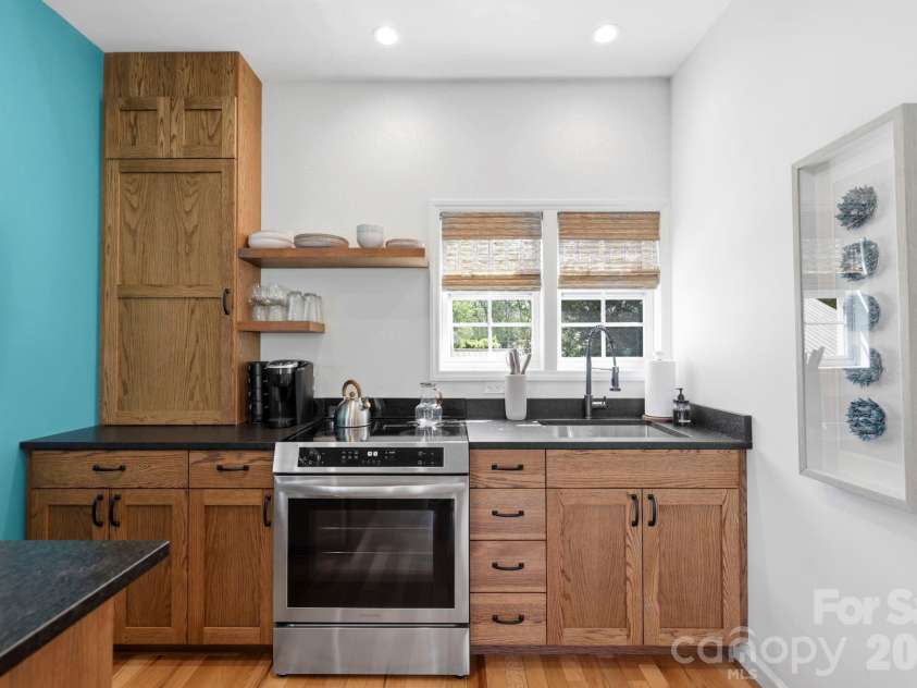 107 5th Street, Black Mountain, NC 28711.  MLS# CAR4371363, YatesRealty ID 15401. Upper level back house kitchen