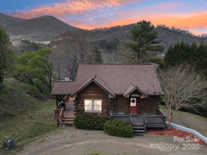 36 Cheyenne Court, Maggie Valley, NC 28751.  MLS# CAR4243964, YatesRealty ID 15405. Home at dusk