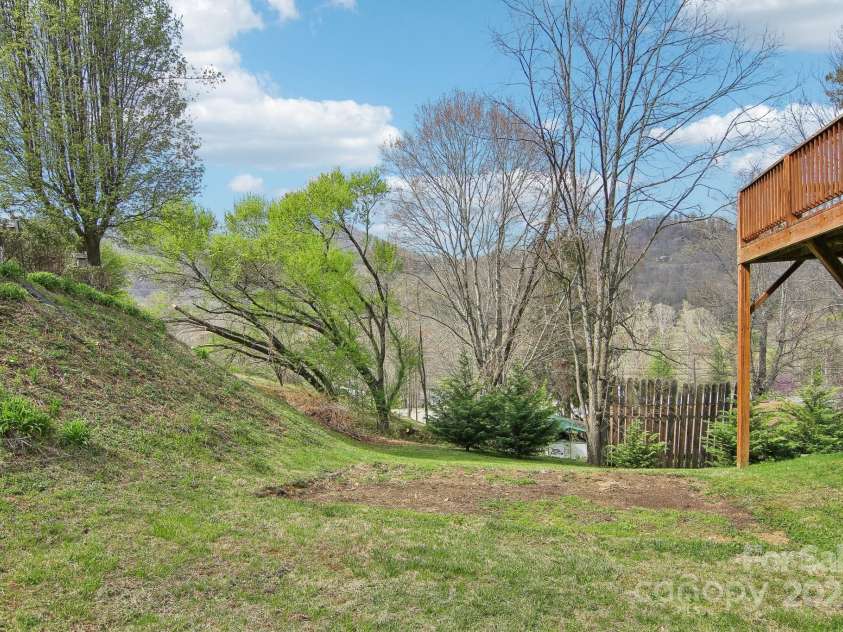 36 Cheyenne Court, Maggie Valley, NC 28751.  MLS# CAR4243964, YatesRealty ID 15405. Side yard