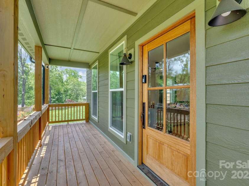 30 Spaulding Drive, Candler, NC 28715.  MLS# CAR4255062, YatesRealty ID 15406. Covered front porch