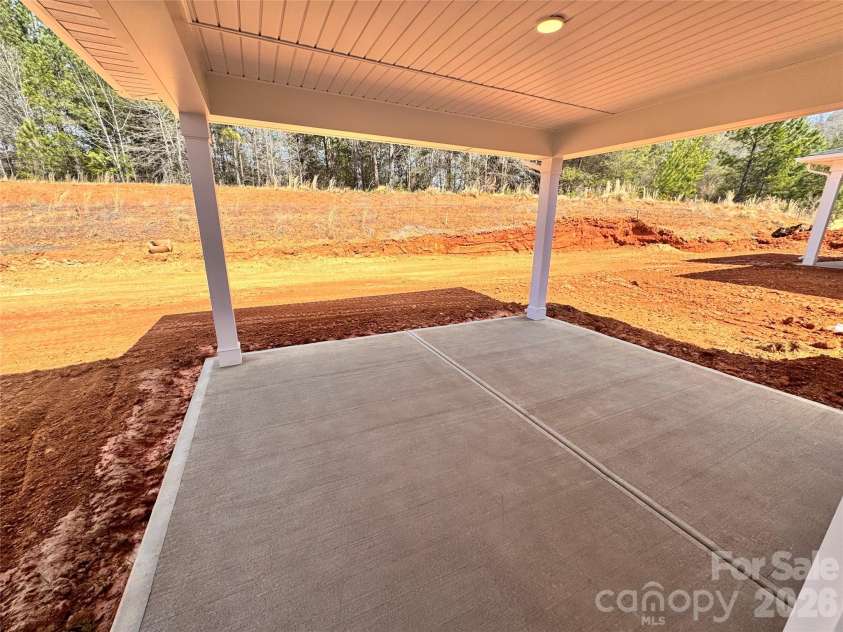 716 Inwood Hill Drive, Gastonia, NC 28056.  MLS# CAR4327869, YatesRealty ID 15410. Back patio and backyard