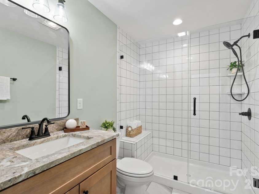 56 White Oak Place, Mars Hill, NC 28754.  MLS# CAR4334521, YatesRealty ID 15413. Full bathroom w/tiled walk-in shower