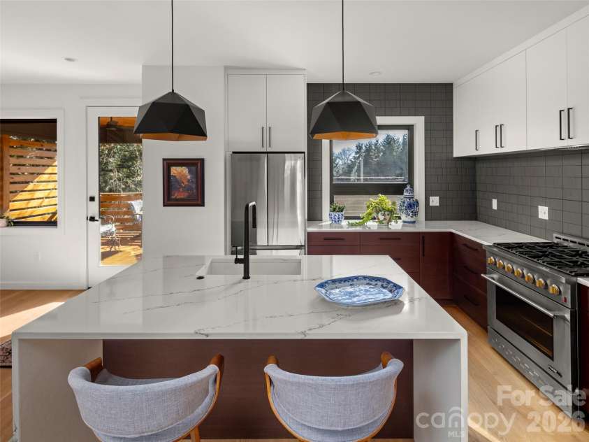 60 Harvard Place, Asheville, NC 28806.  MLS# CAR4403938, YatesRealty ID 15418. Kitchen looking onto the Covered Deck