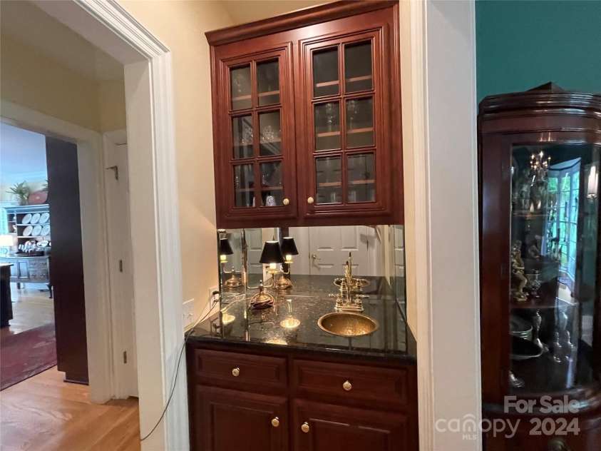500 Muirfield Drive, Albemarle, NC 28001.  MLS# CAR4138063, YatesRealty ID 15419. Built-in wet bar between kitchen and dining room