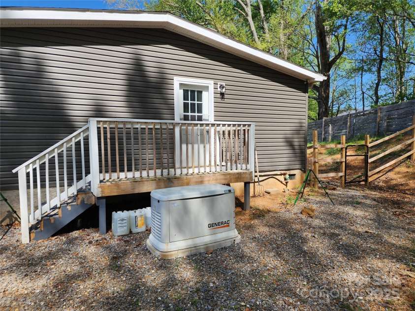 583 Cane Branch Road, Burnsville, NC 28714.  MLS# CAR4251066, YatesRealty ID 15423. Back door at end of the hall with emergency generator