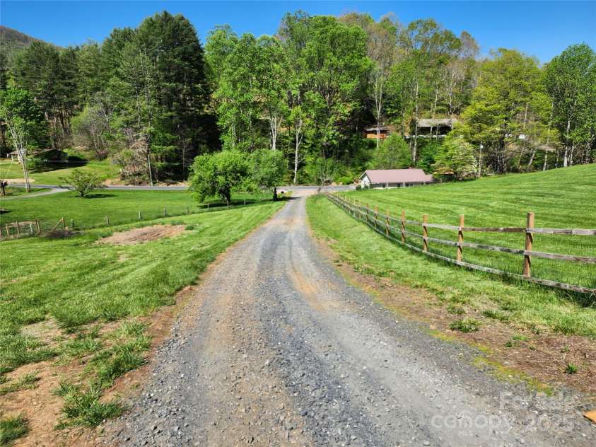 583 Cane Branch Road, Burnsville, NC 28714.  MLS# CAR4251066, YatesRealty ID 15423. Driveway leading to Cane Branch Road