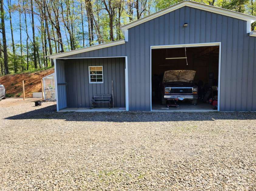583 Cane Branch Road, Burnsville, NC 28714.  MLS# CAR4251066, YatesRealty ID 15423. Garage workshop and bay 1